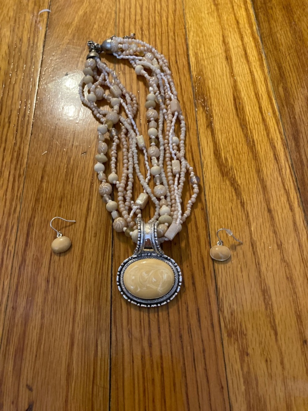 Beige Multi-Strand Beaded Necklace with Carved Pendant and Matching Earrings
